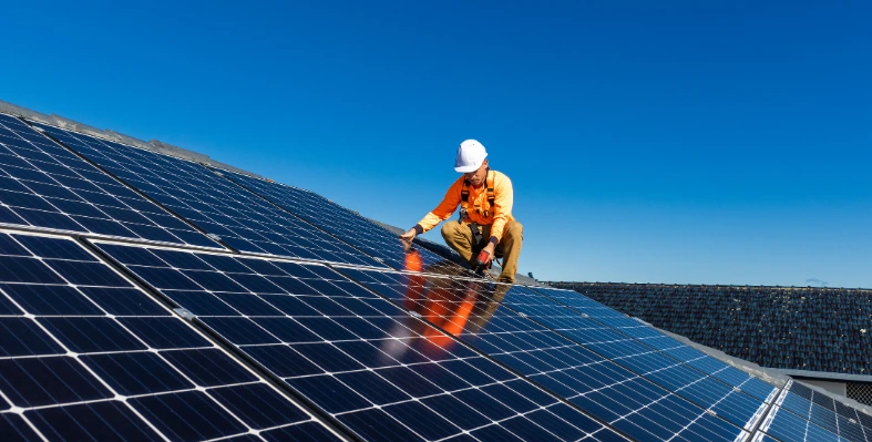 A man installing solar panels